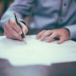Person writing a report