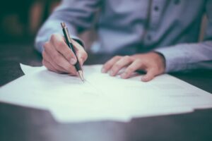 Person writing a report